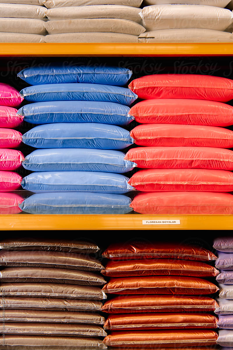 Bags with colorful instant paints on shop shelves