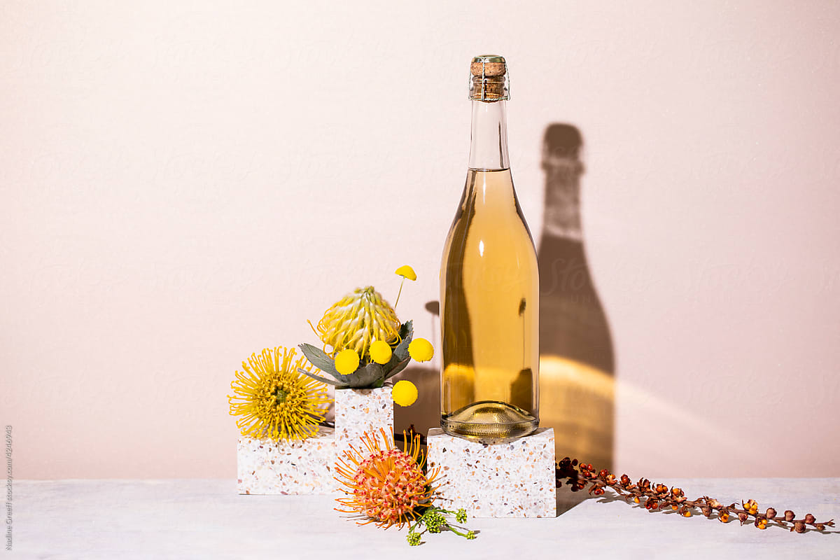 Champagne bottle still life with flowers