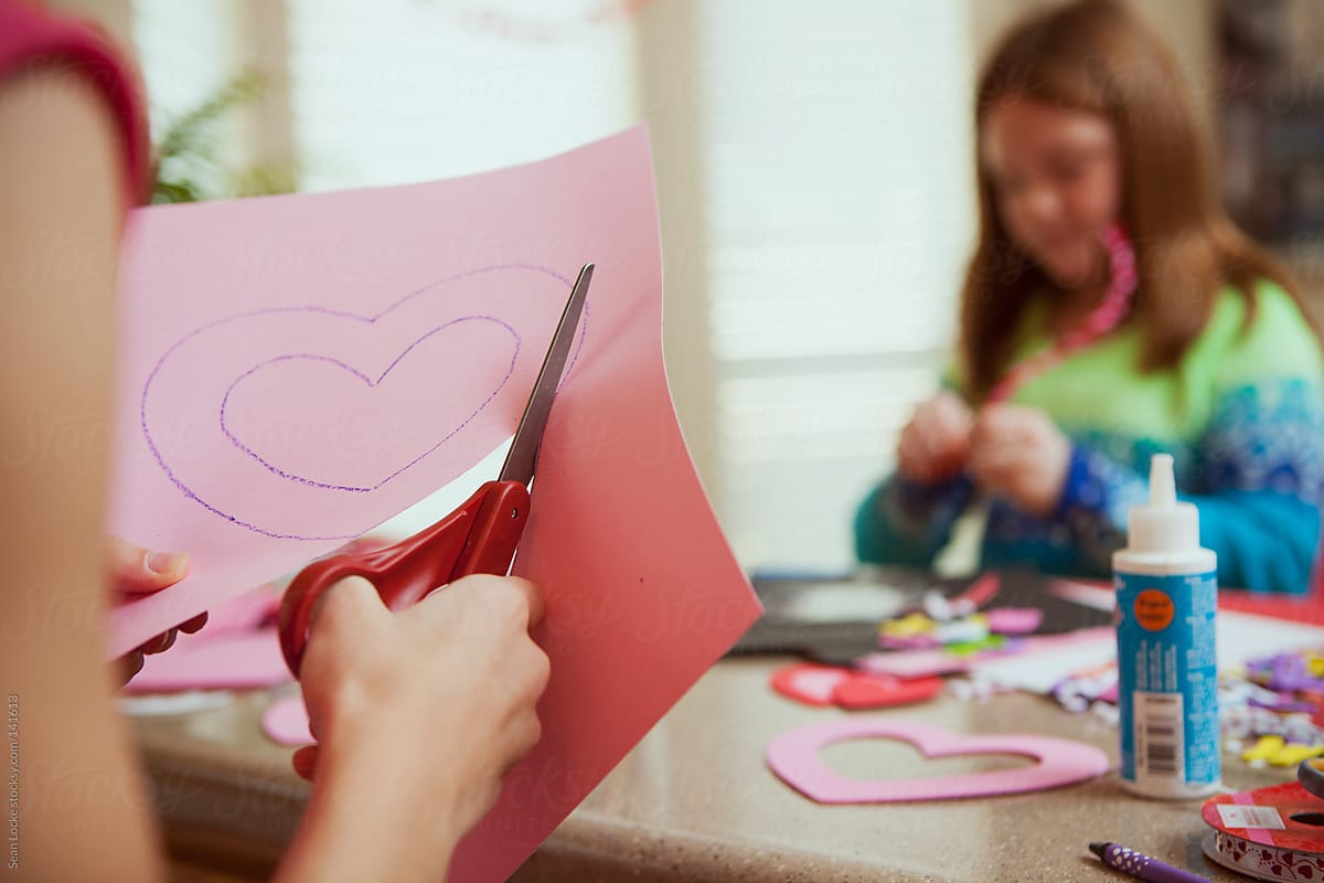Valentine: Cutting Out A Paper Heart