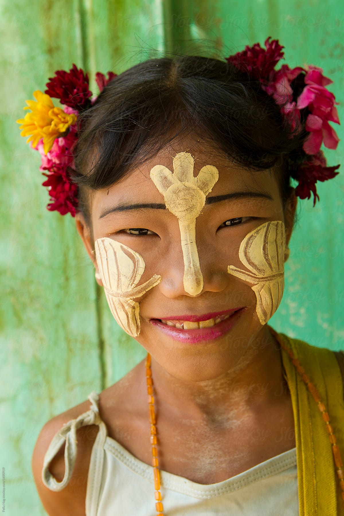 Young burmese girl with Tanaka on her face