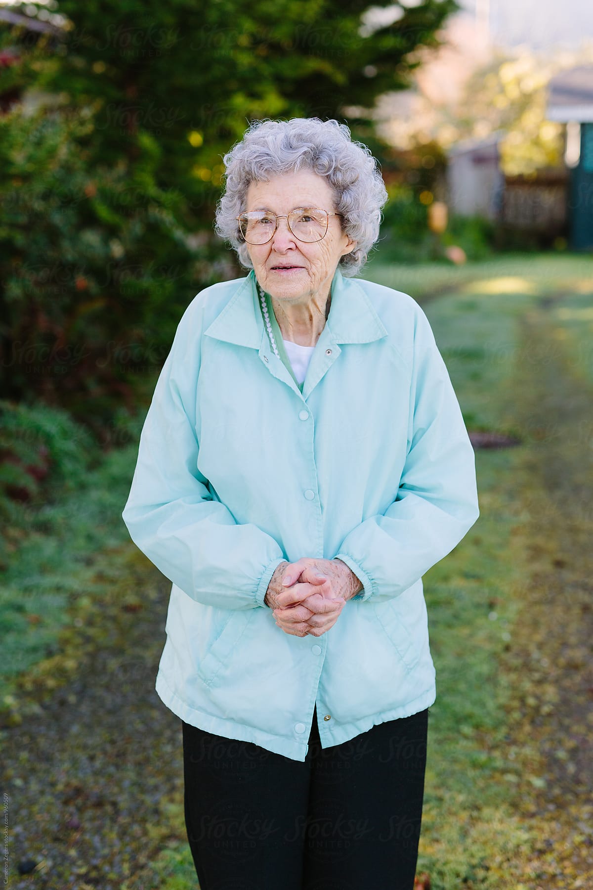 Elderly Woman Standing Outdoors by Stocksy Contributor Cameron