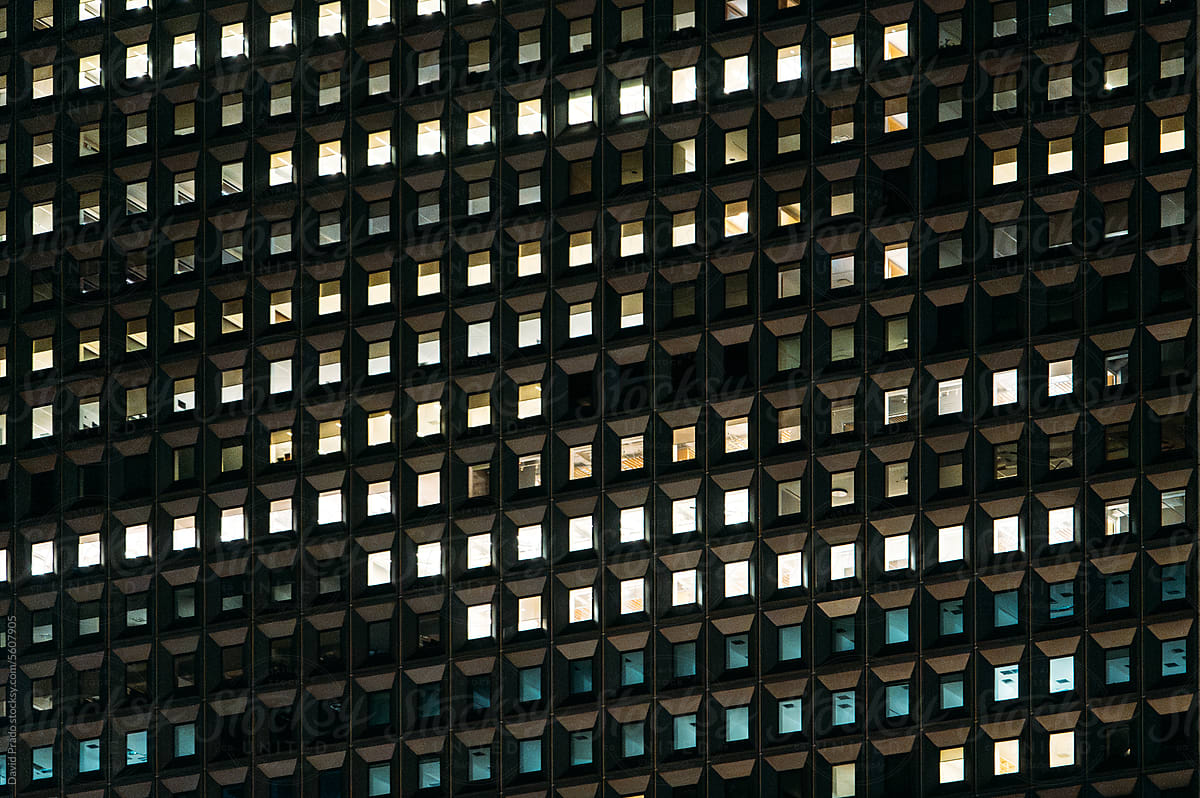 Facade of building with glass windows at night