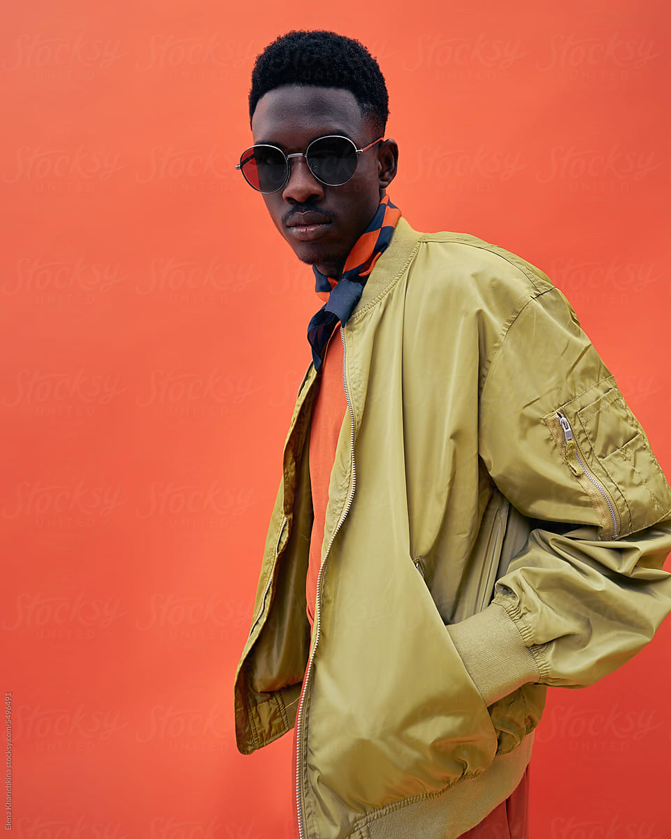 Black fashionable man model in stylish bomber jacket