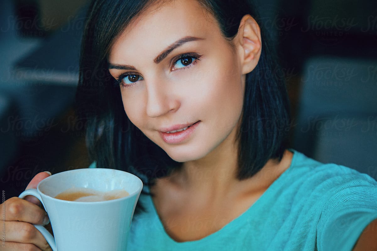 Attractive Young Woman Drinking Coffee By Danil Nevsky Stocksy United 7510