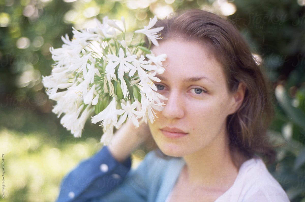 A Beautiful Woman With A Flower By Stocksy Contributor Anna Malgina Stocksy