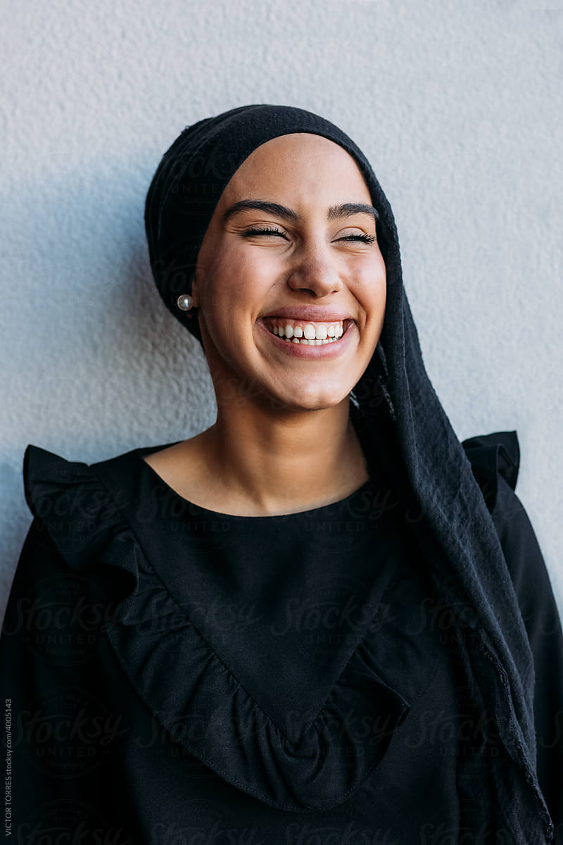 Cheerful muslim woman in headscarf