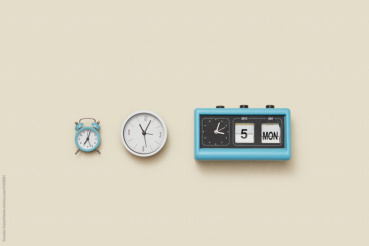 Retro, alarm, modern and calendar clocks in a row.