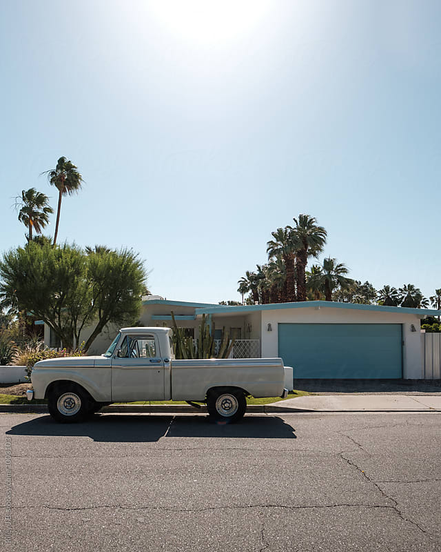Vintage truck parked outside mid0century house