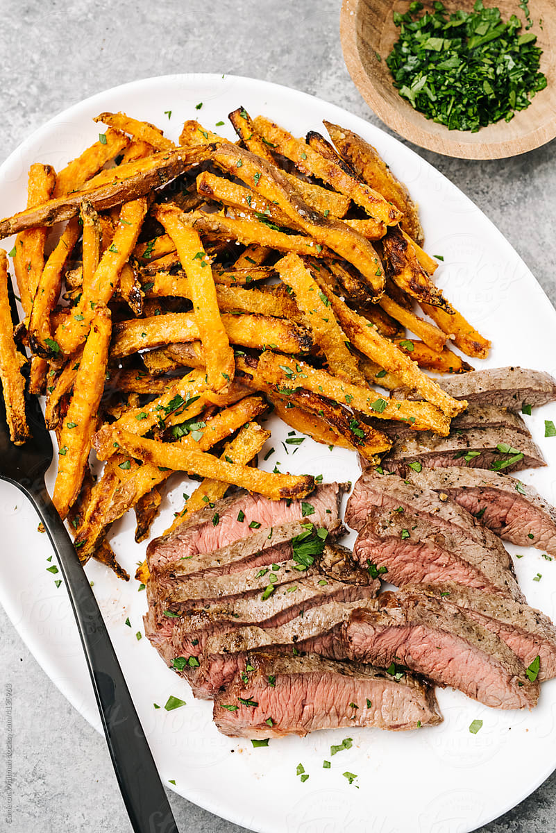 Steak and sweet potato fries dinner