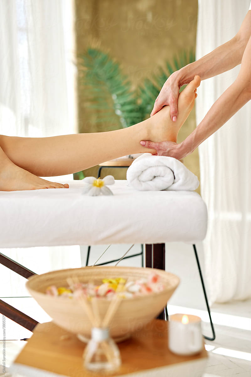 Anonymous client receiving massage care in spa