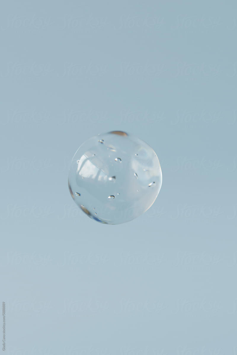 3D Render of a Solitary Water Droplet in Mid-Air with Soft Blue