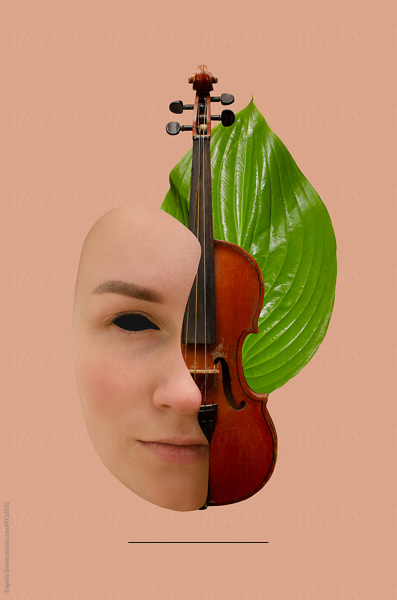 Half of a woman\'s face, old violin and green leaf