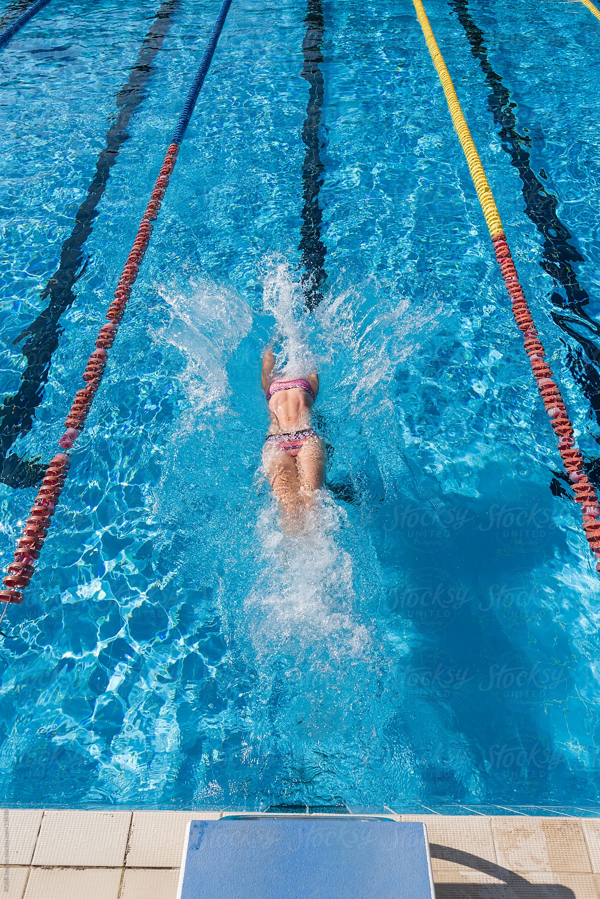 Female swimmer propelling in the swimming pool