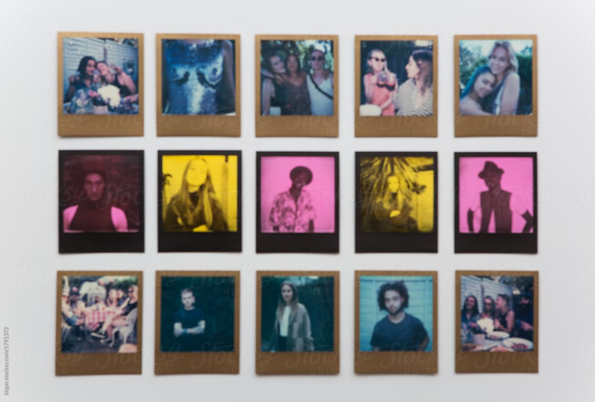 Defocussed photo of fifteen polaroid prints arranged in three rows of five.