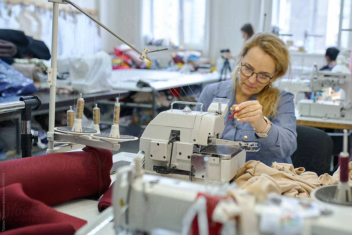 business woman fashion designer at her in her clothing manufacturing office