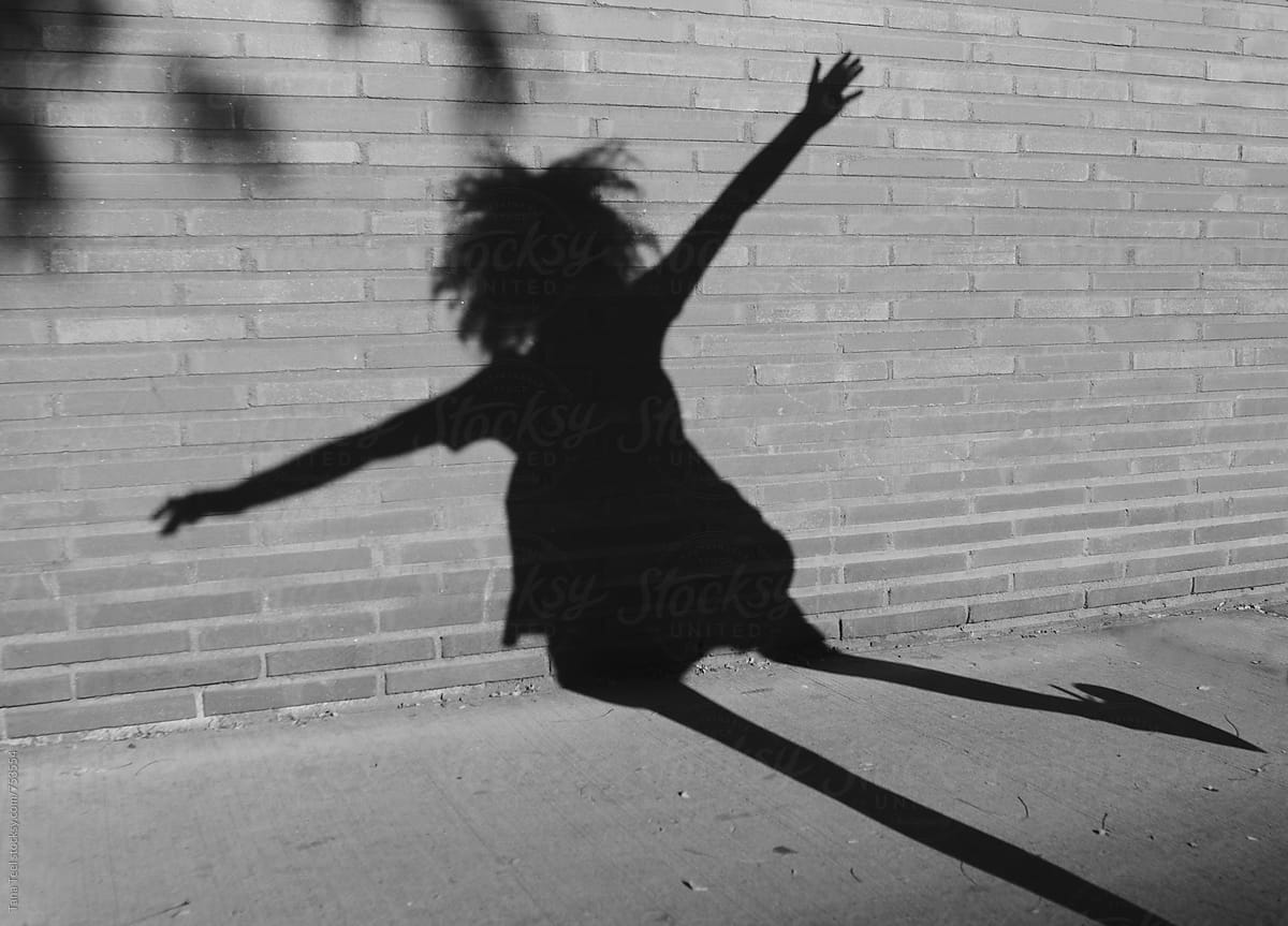 playful shadow of female dancing