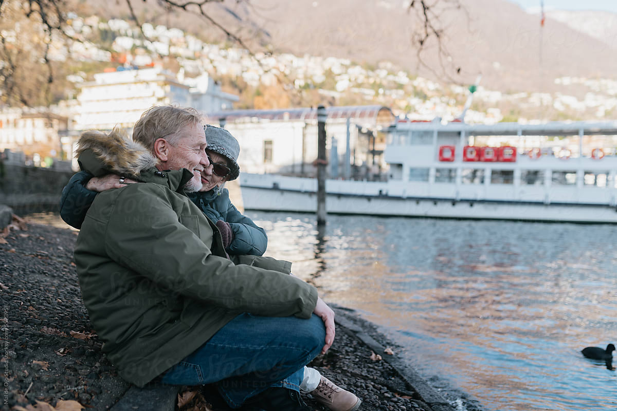 Senior Couple Sitting by the Lake