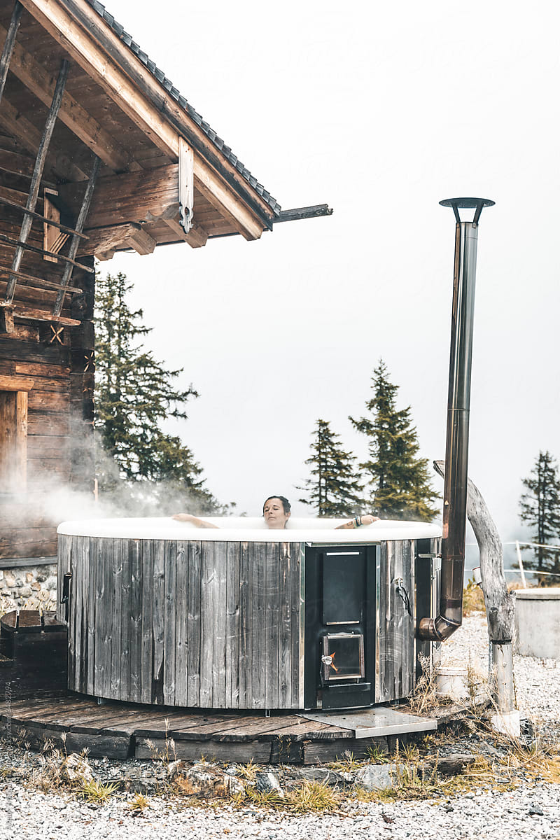 woman relaxing in outdoor hot tub