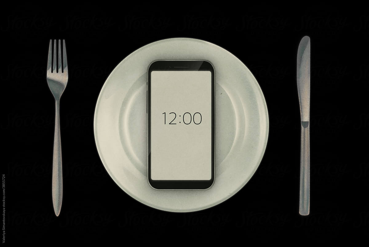 Smartphone on a plate with cutlery