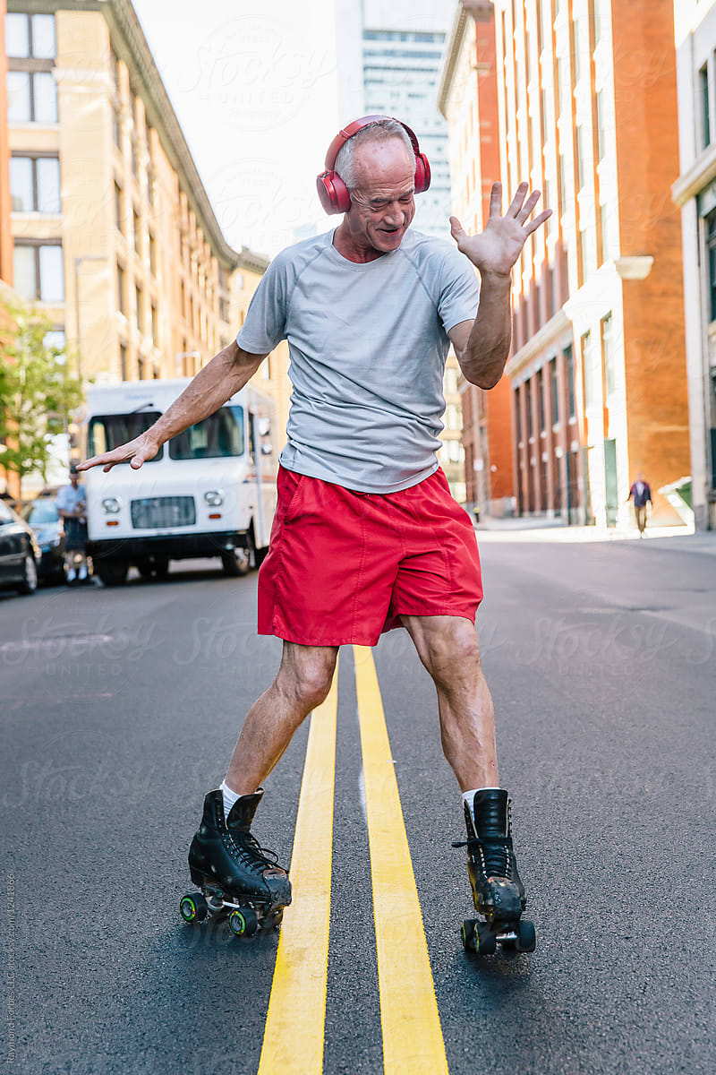Download Senior Man Dancing On Roller Skates In City By Raymond Forbes Photography Senior Style