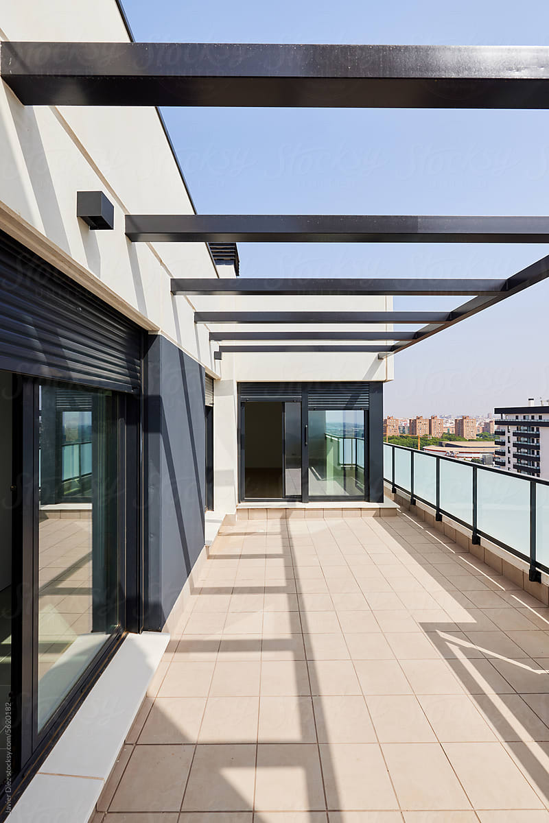 Empty terrace of contemporary building in sunlight
