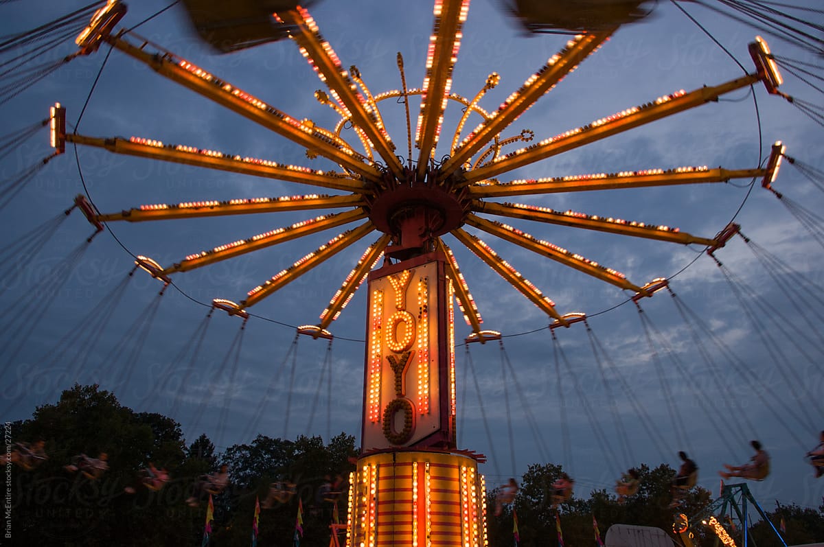 Carnival Rides at Dusk with Motion Blur