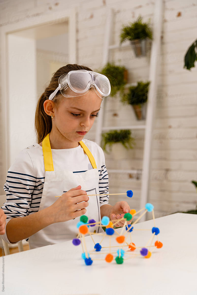 Child making geometric shapes for engineering and STEM concept