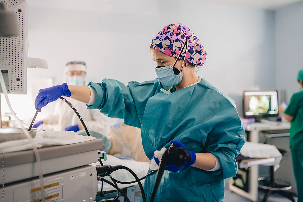 A caregiver sterilizes a colonoscopy kit
