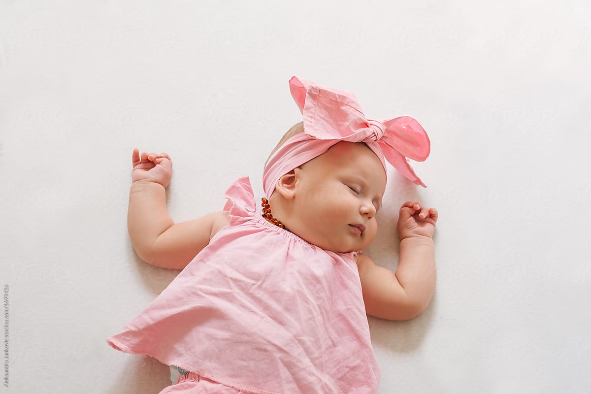 Sleeping Baby Girl In Pink Clothes