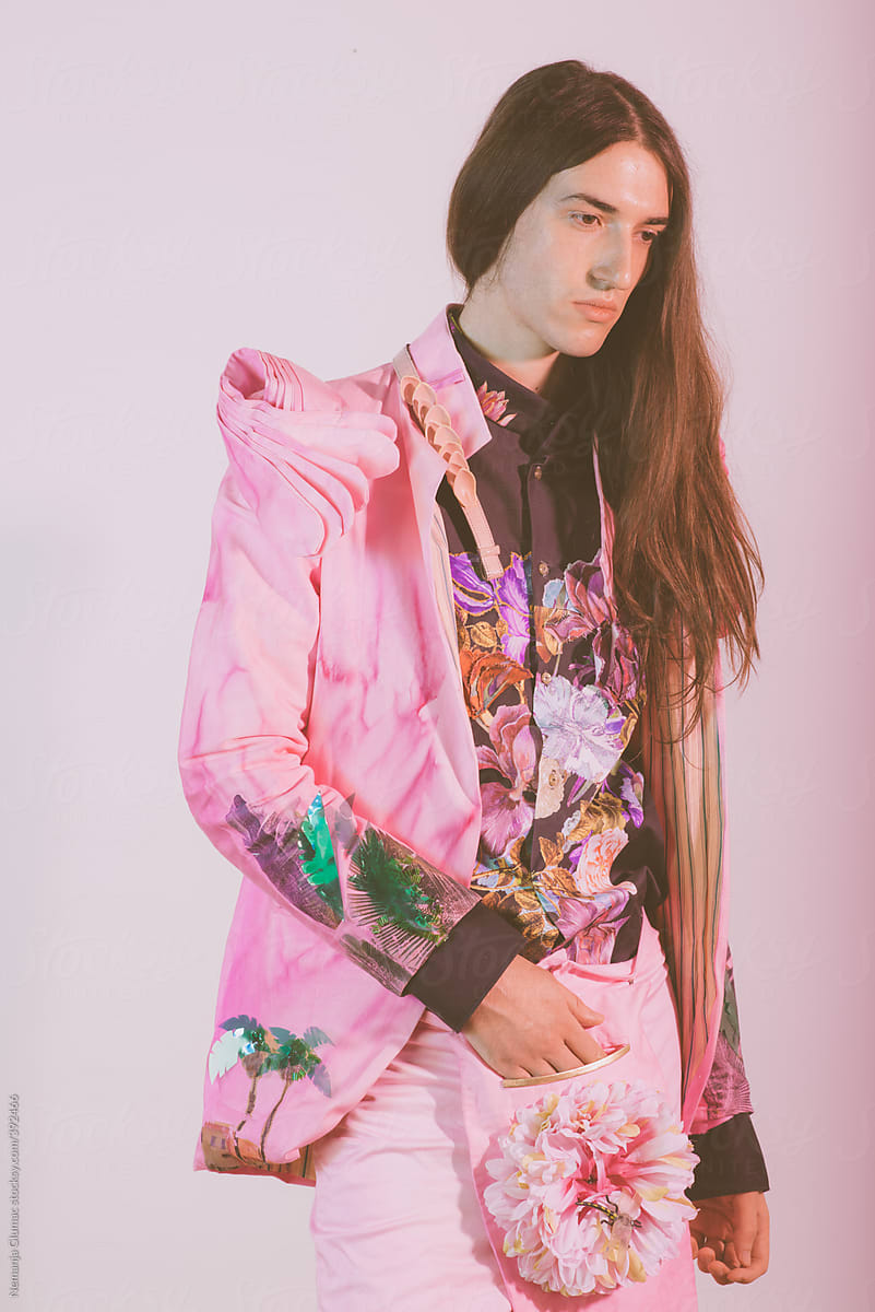 Male Fashion Model With Long Hair Posing in Pink Floral Costume