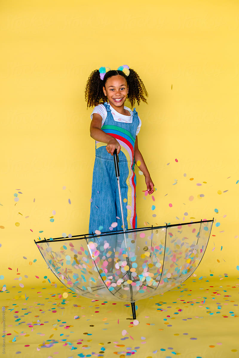 Girl Catching Confetti With Clear Umbrella by Stocksy Contributor Erin  Brant - Stocksy