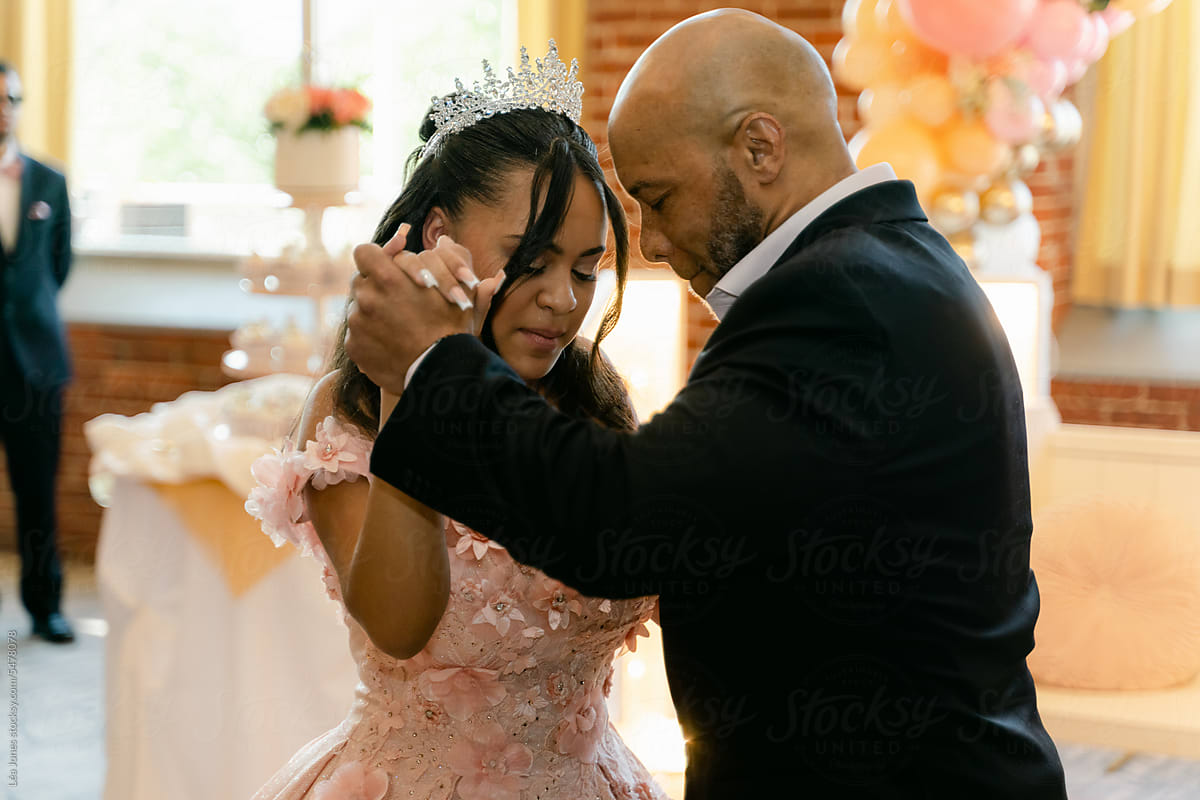 father and daughter dance during quinceanera celebration