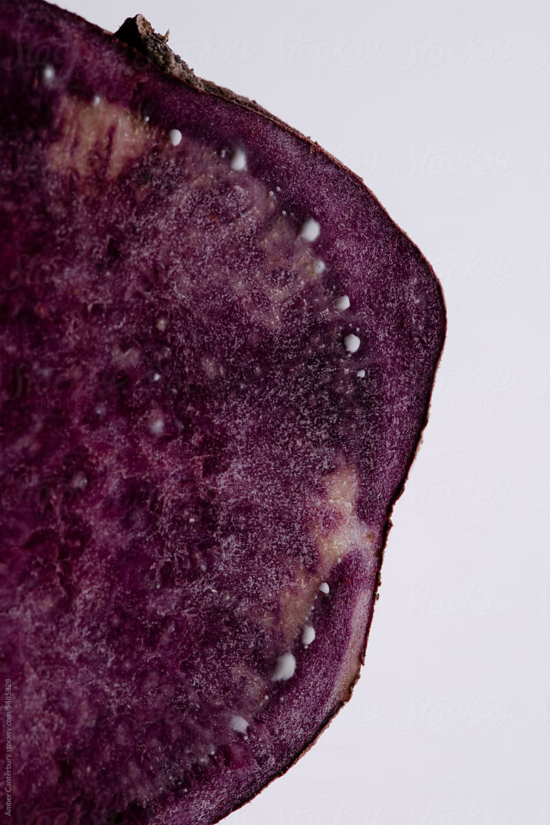 Sliced purple sweet potato with starch seeping out