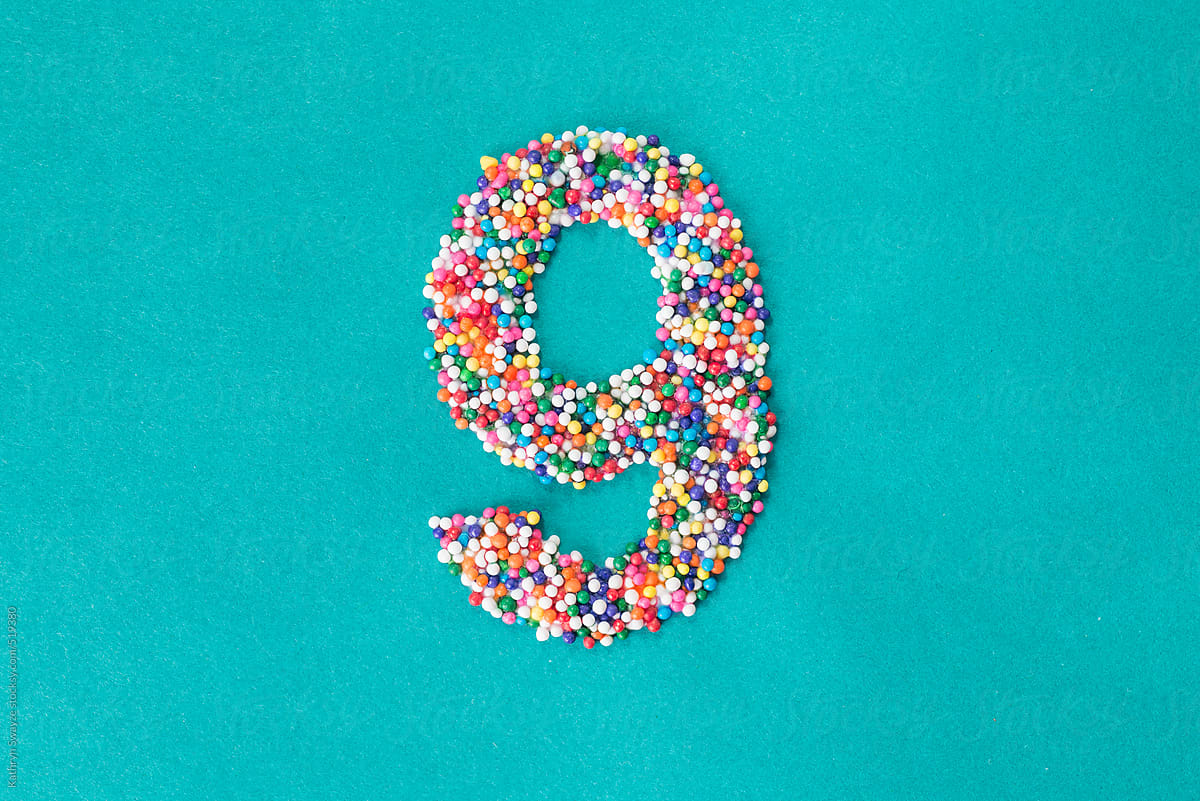 The number nine built from nonpareils