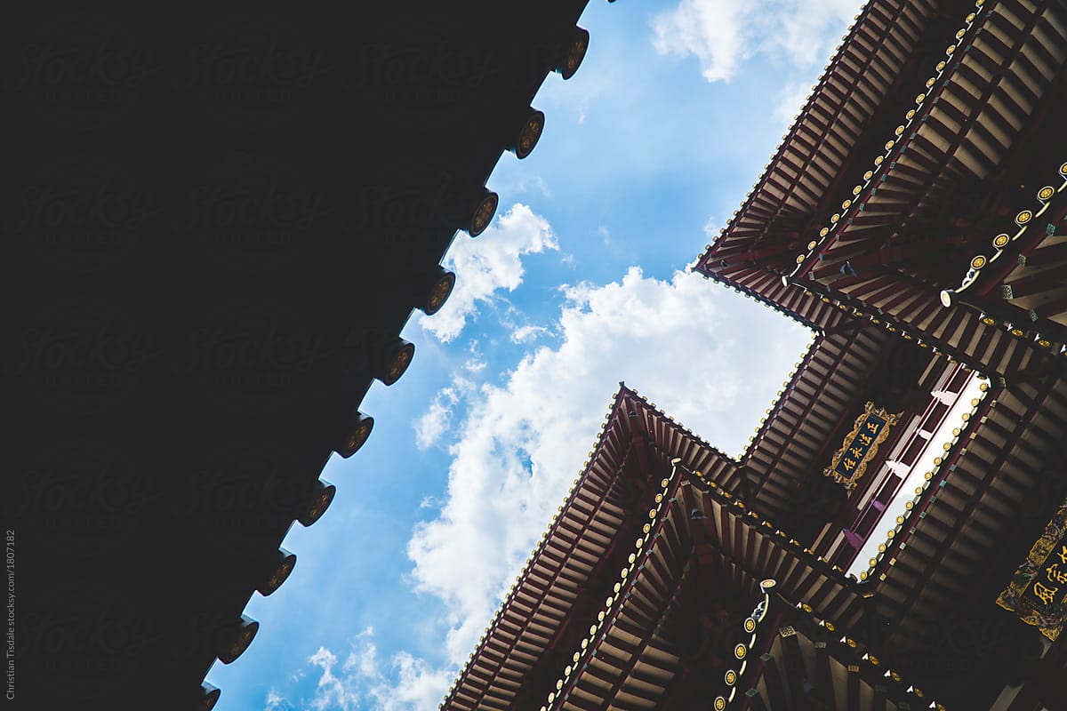 Looking up towards the layered roof of a temple