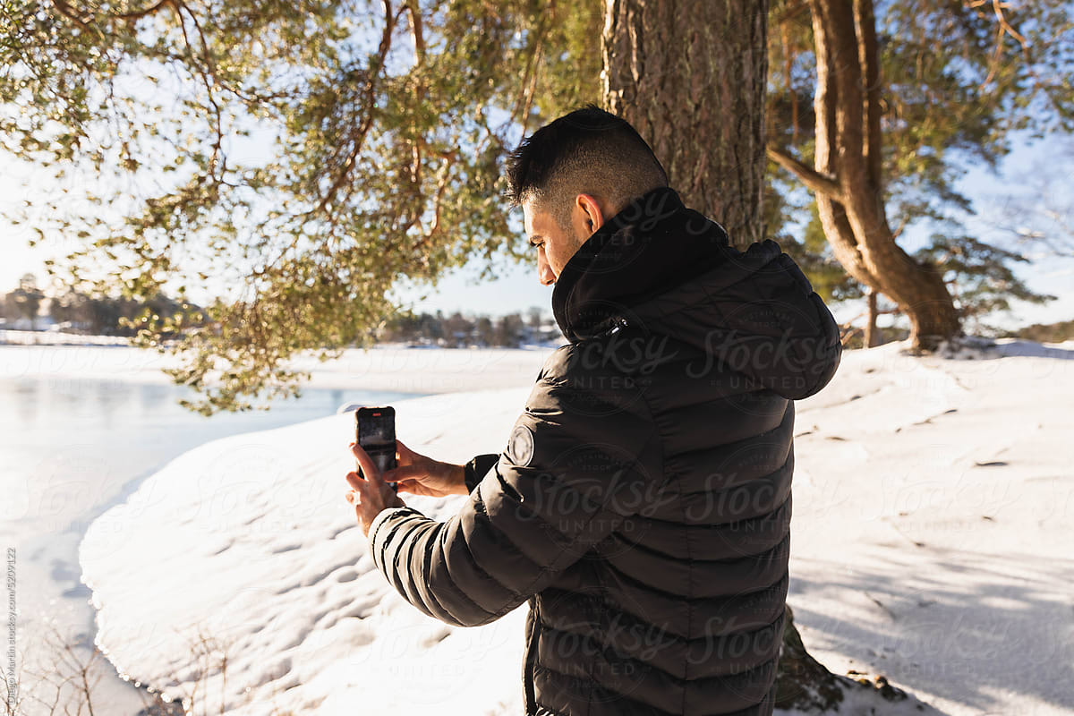 Man with smartphone outdoors