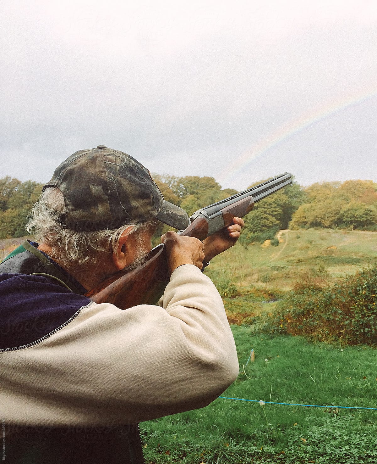 Man with a rifle shooting