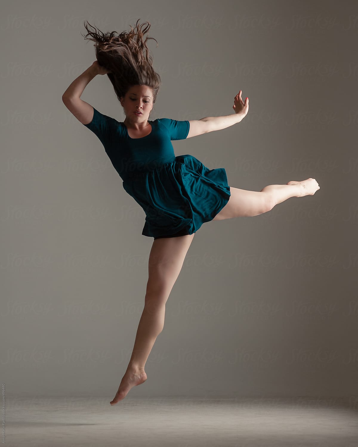 Brunette Female Contemporary Dancer With Short Green Dress by Stocksy  Contributor Anna-Marie Panlilio - Stocksy