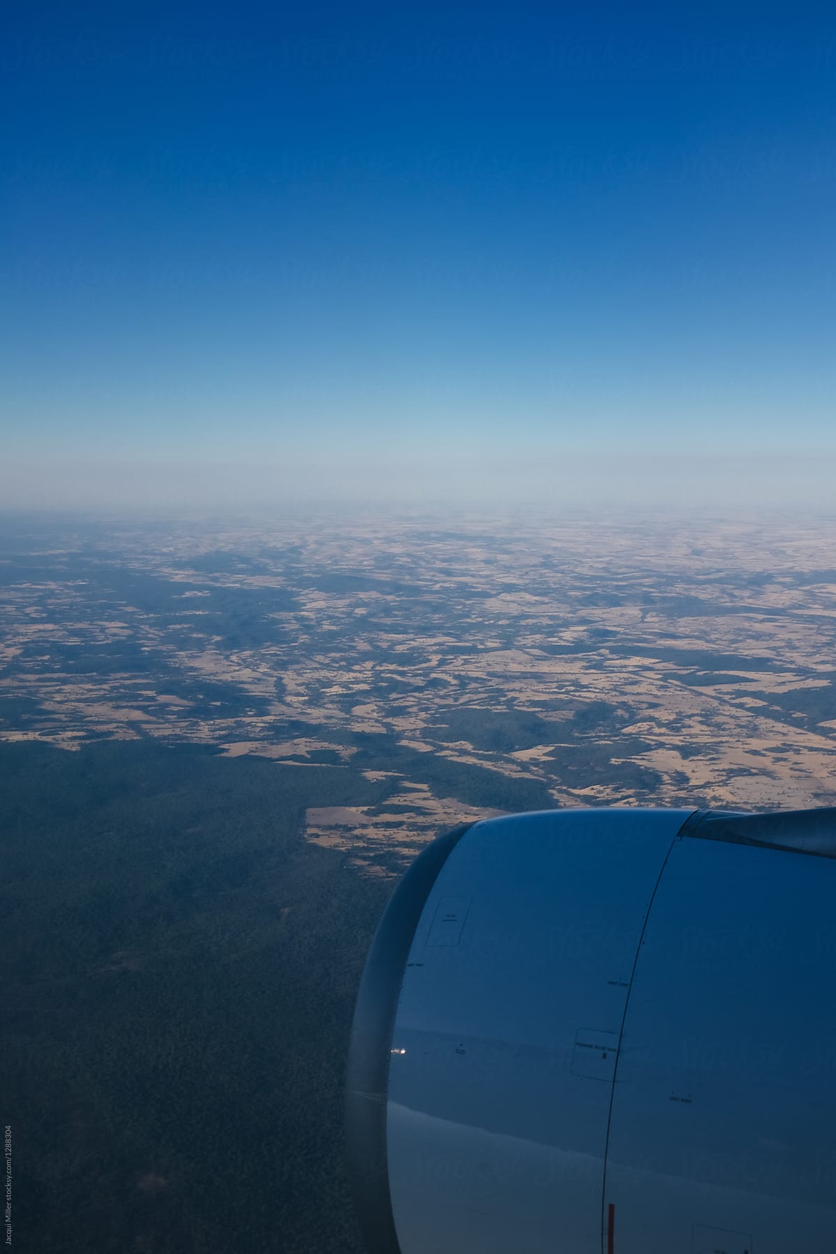 Flying toward Perth, Western Australia, with smoke or dust on the horizon