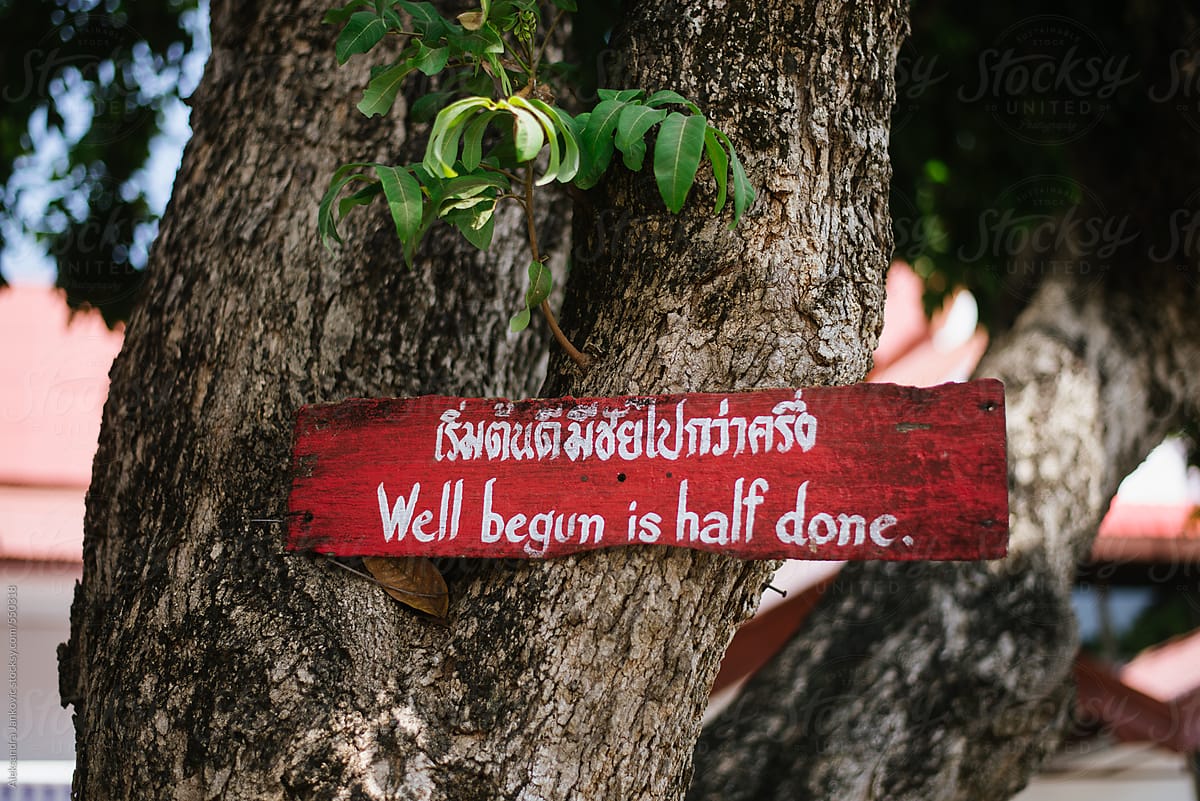 Buddhist quote written on a wooden sign