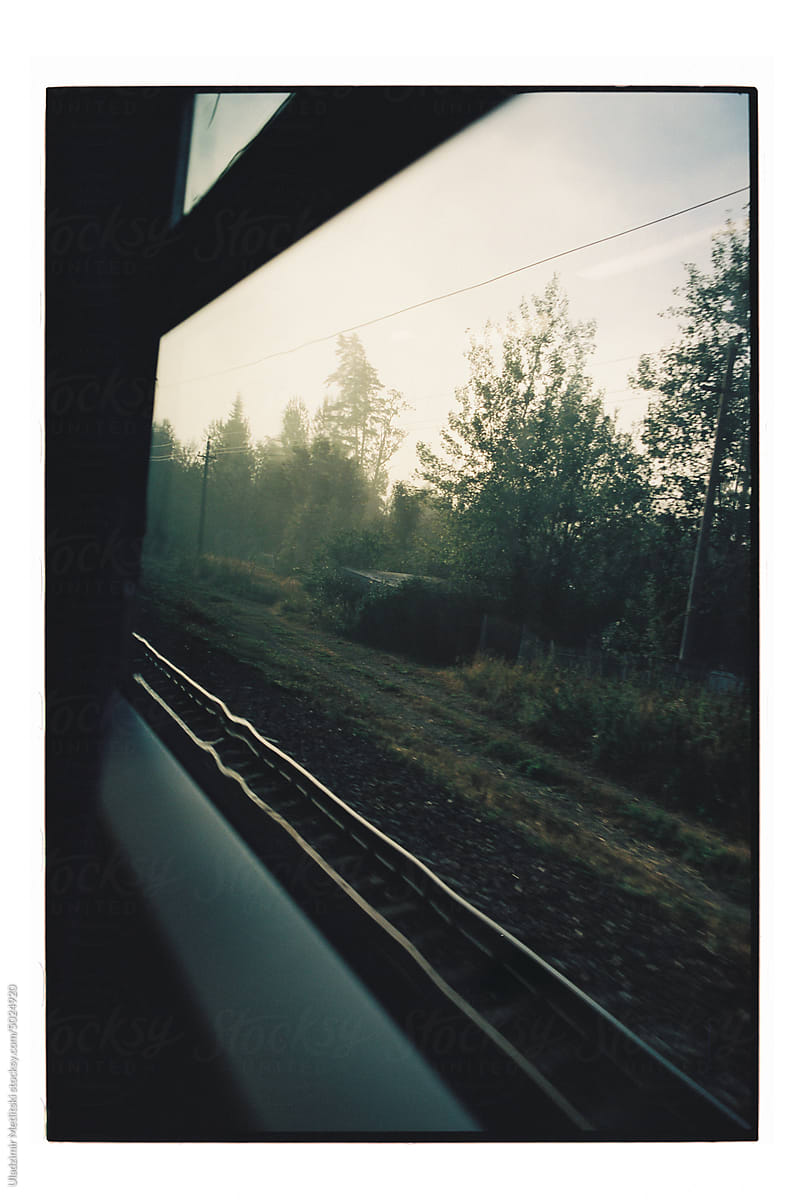 Traveling by train on a foggy morning.