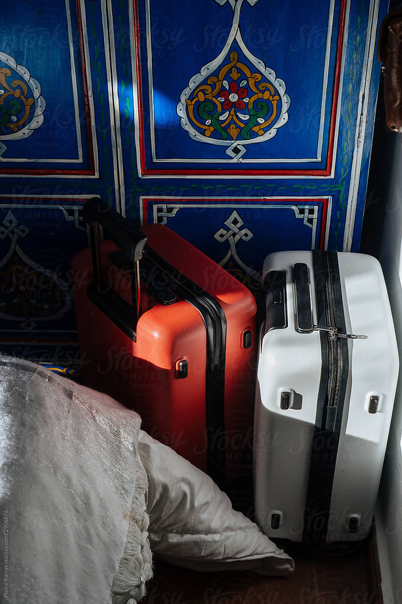 Suitcases by wardrobe in Arabic bedroom