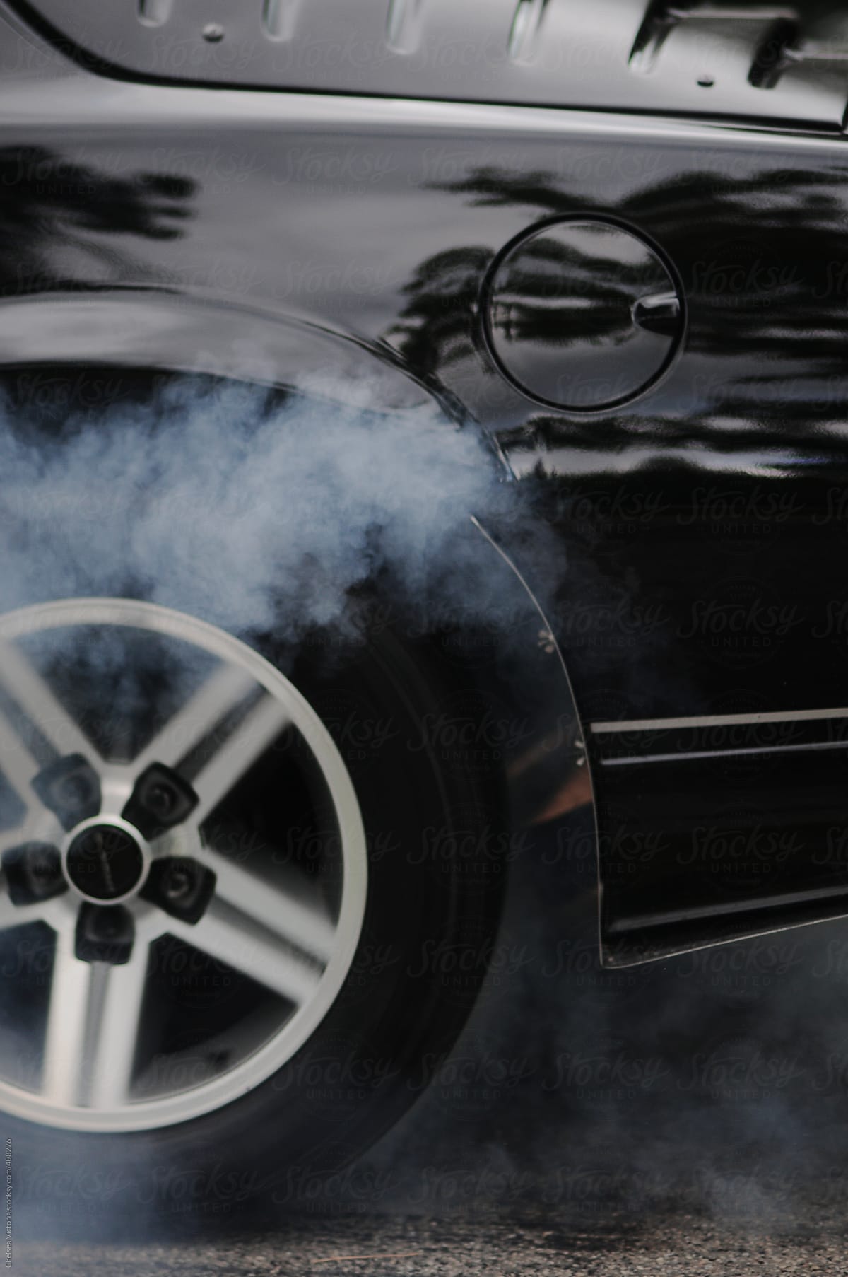 Car in motion with smoke coming from the tires