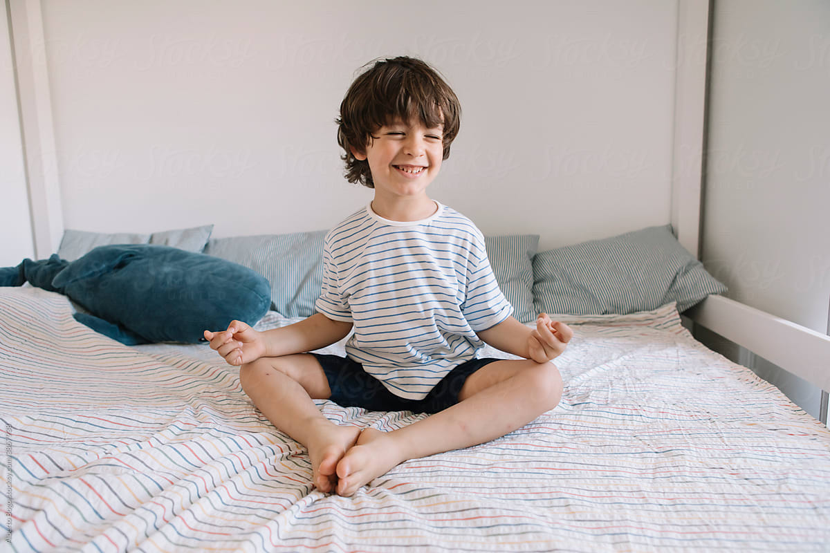 Joyful Boy Practicing Yoga And Meditation