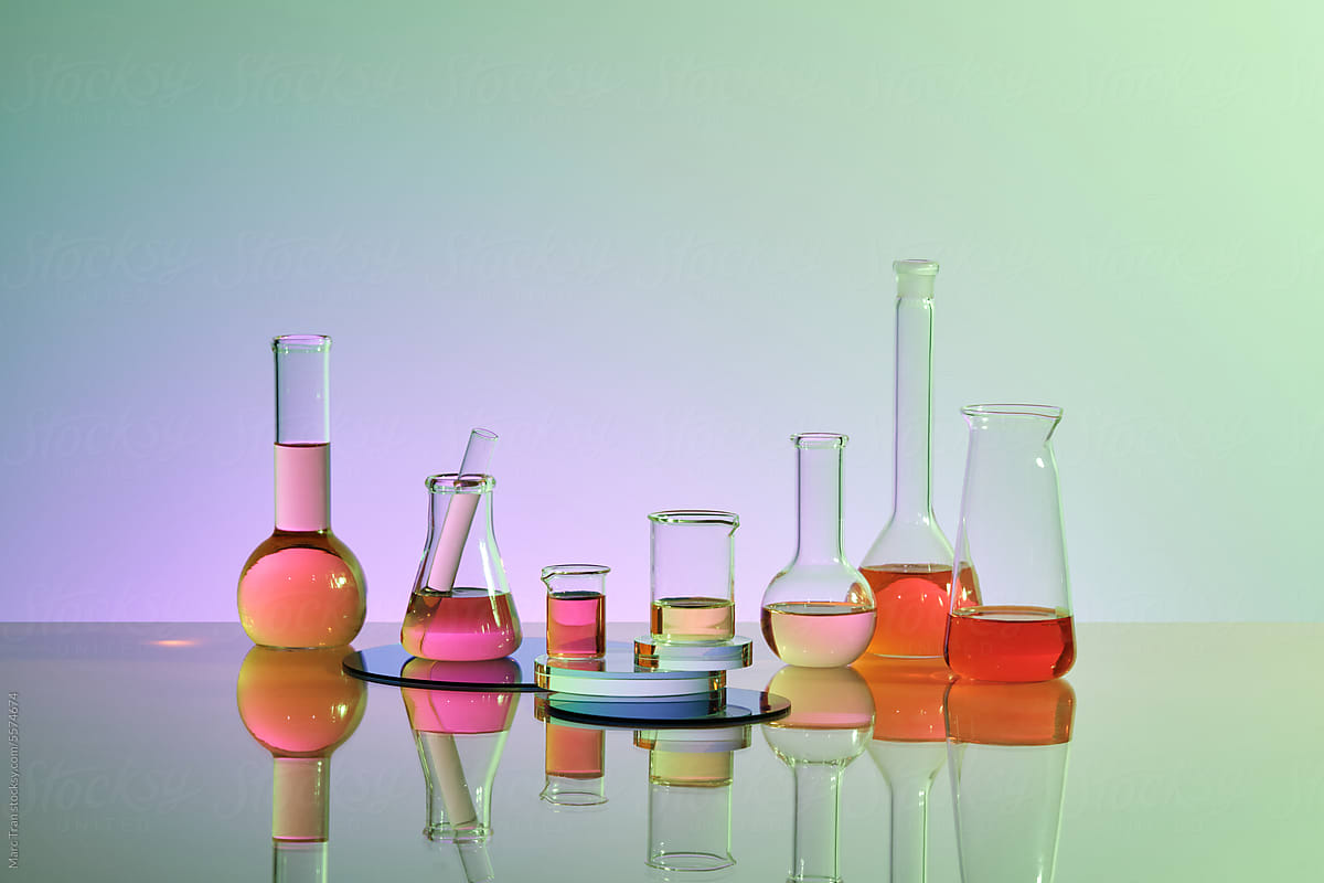 Laboratory glassware with colorful chemical reagents