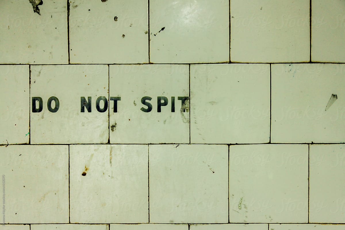 Do Not Spit sign in subway
