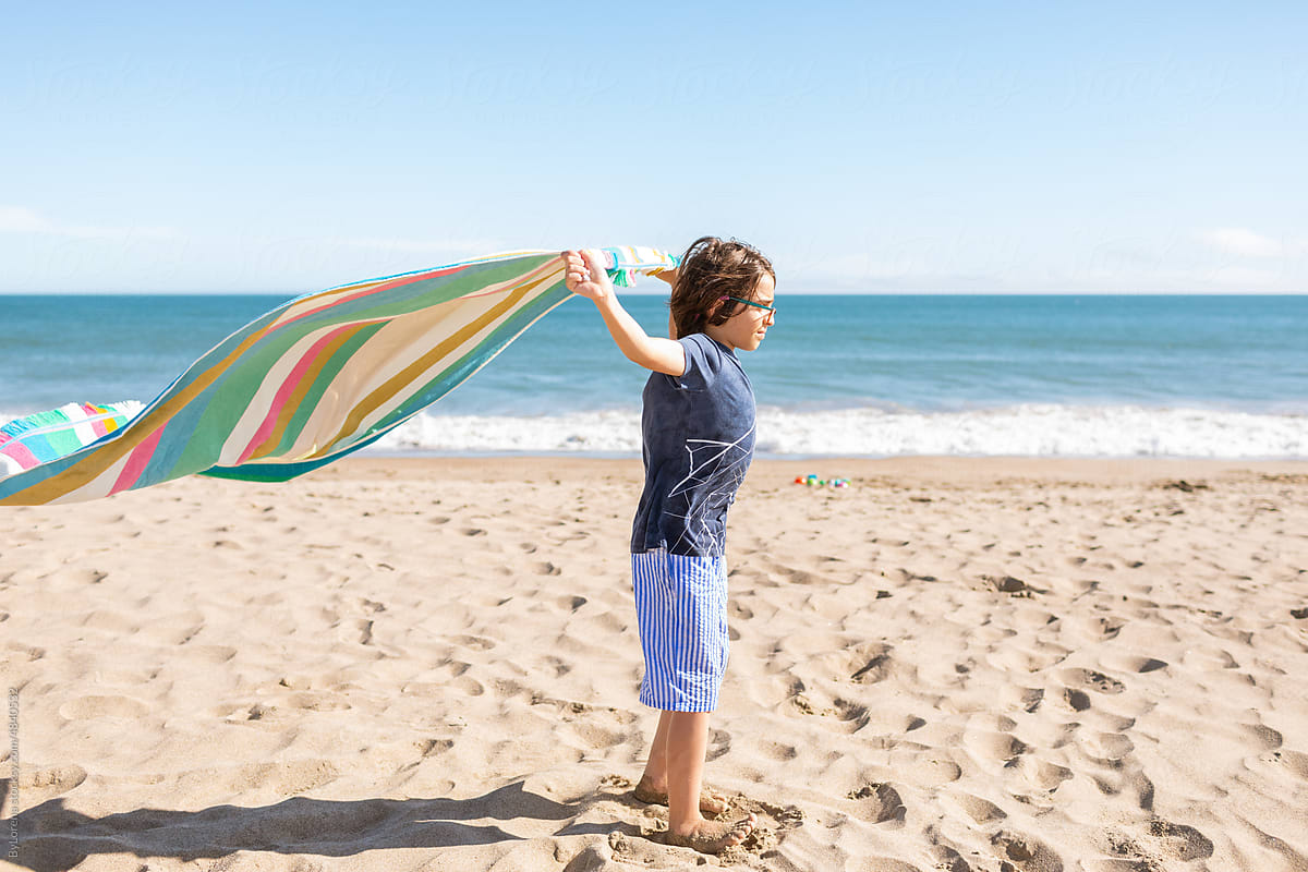 Boy Flying Towel At The Beach By Stocksy Contributor ByLorena Stocksy boy-flying-towel-at-the-beach-by-stocksy-contributor-bylorena-stocksy