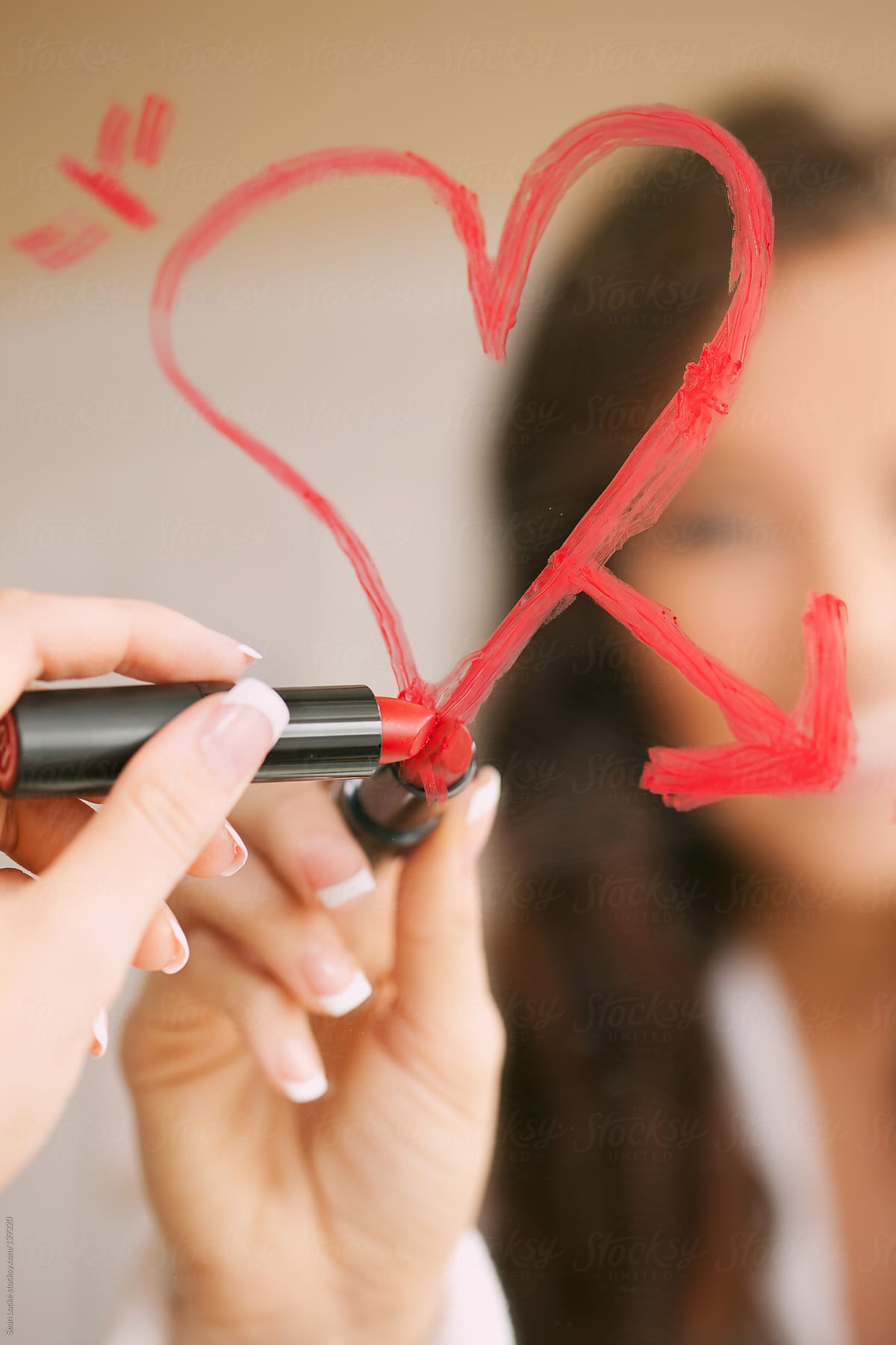 Valentine's: Woman Drawing Heart On Bathroom Mirror In Lipstick