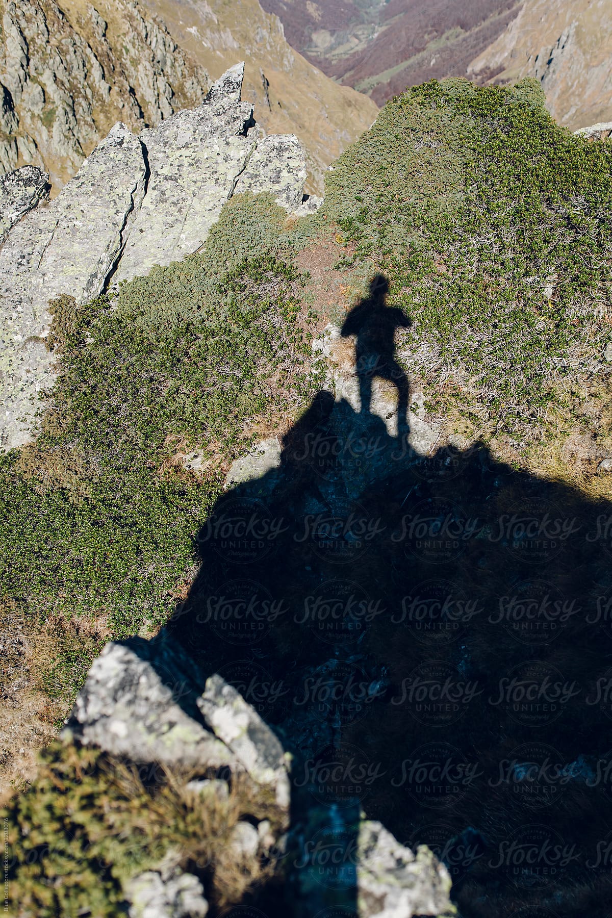 shadow of a man in the top of the mountain