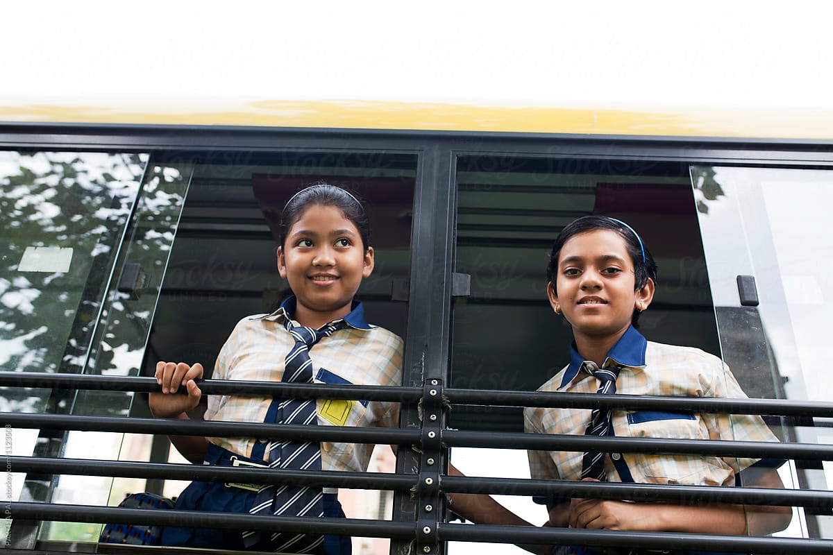 Teenage girls with school dress on a school bus